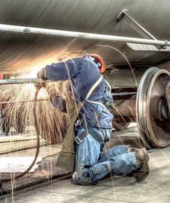 Welding the bottom of a hopper car